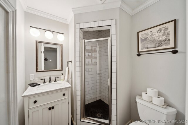 bathroom featuring crown molding, vanity, toilet, and a shower stall