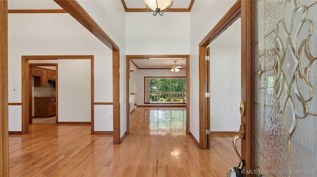 9219 N 134th E Ave, Owasso, OK 74055 - entryway featuring light wood-style floors, ornamental molding, and baseboards