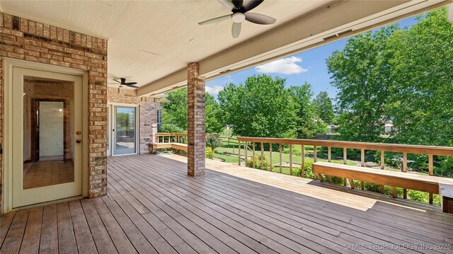 9219 N 134th E Ave, Owasso, OK 74055 - deck with ceiling fan and view of scattered trees