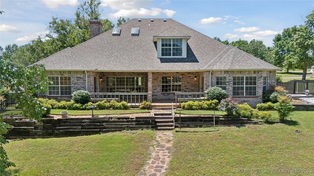 9219 N 134th E Ave, Owasso, OK 74055 - view of front of property with brick siding, a chimney, and a shingled roof