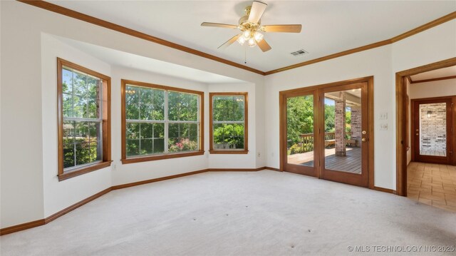 9219 N 134th E Ave, Owasso, OK 74055 - unfurnished room featuring carpet, baseboards, crown molding, and ceiling fan