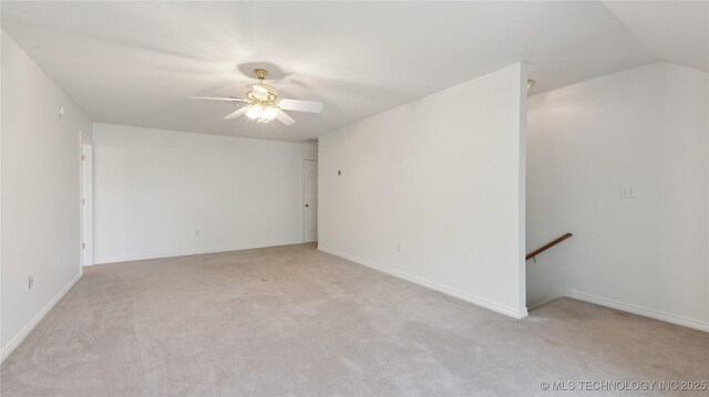 9219 N 134th E Ave, Owasso, OK 74055 - empty room with light carpet, a ceiling fan, and baseboards