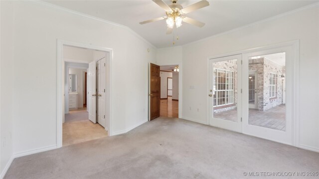 9219 N 134th E Ave, Owasso, OK 74055 - unfurnished bedroom with ornamental molding, carpet flooring, access to exterior, baseboards, and ceiling fan