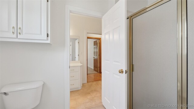 9219 N 134th E Ave, Owasso, OK 74055 - full bathroom featuring toilet, a shower stall, and vanity
