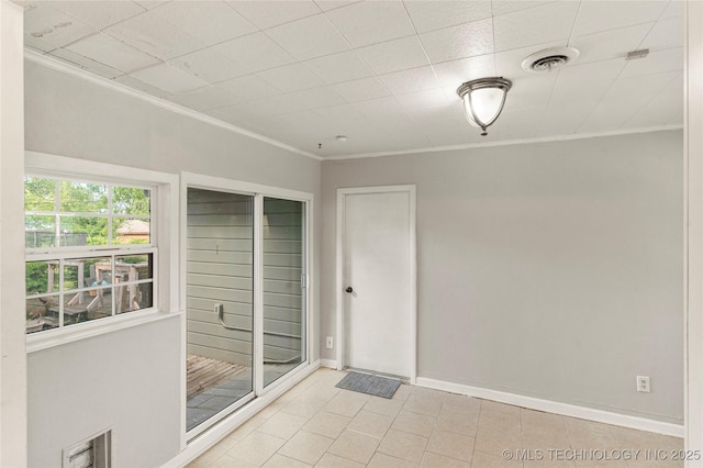 interior space with visible vents, ornamental molding, and baseboards