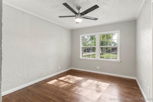 empty room with ceiling fan, a textured ceiling, wood finished floors, ornamental molding, and a textured wall