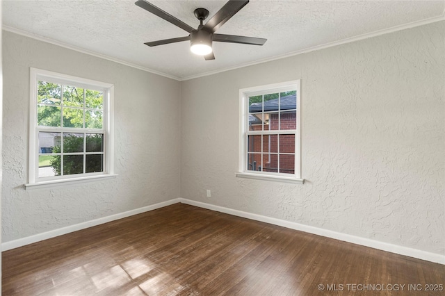 spare room with crown molding, a ceiling fan, a textured ceiling, and dark wood-style flooring