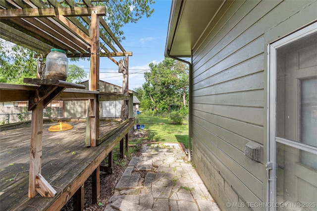 view of side of home featuring a wooden deck