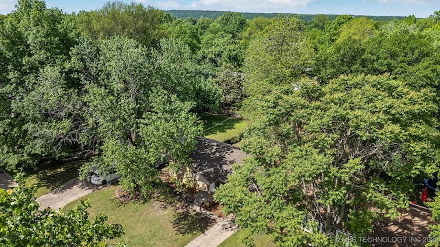 bird's eye view featuring a view of trees