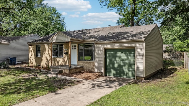 ranch-style home with a garage, a front lawn, fence, and driveway