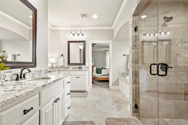 full bath with vanity, ornamental molding, a shower stall, and visible vents