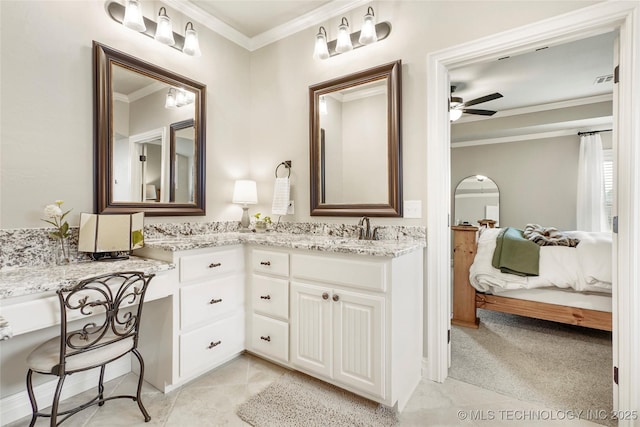 ensuite bathroom featuring double vanity, ceiling fan, a sink, ornamental molding, and ensuite bathroom
