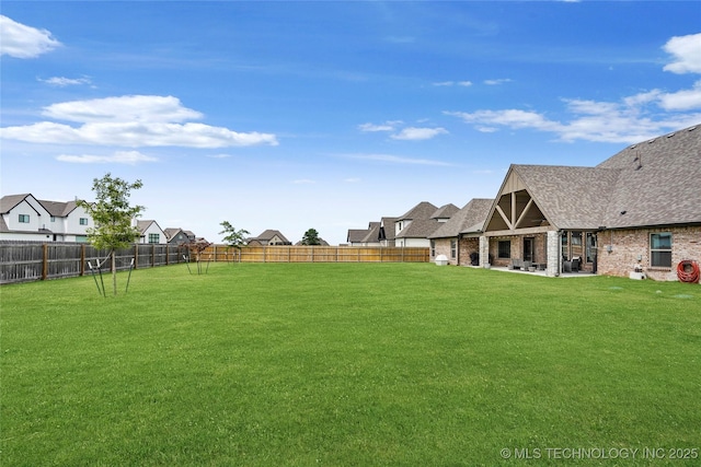 16622 S 2 W Ave, Glenpool, OK 74033 - view of yard featuring a residential view, a fenced backyard, and a patio area