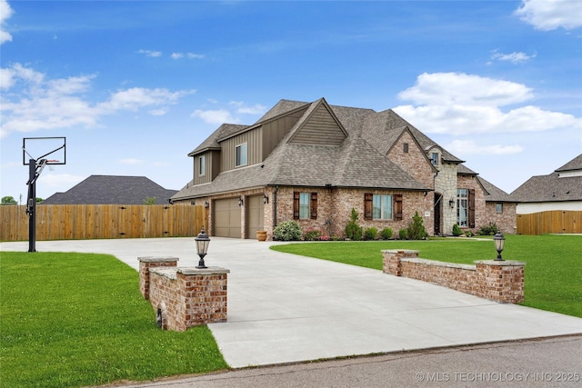 french country inspired facade featuring roof with shingles, a garage, fence, a front lawn, and concrete driveway