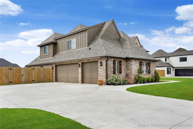 view of front of property featuring driveway, brick siding, fence, an attached garage, and a shingled roof