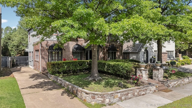 2252 S Troost Ave, Tulsa, OK 74114 - view of front of house featuring brick siding and fence