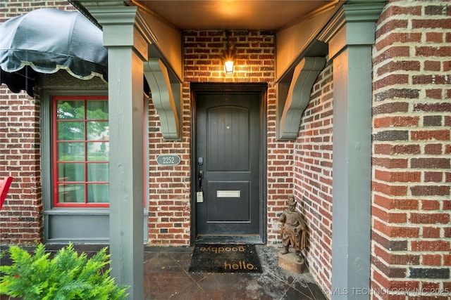 2252 S Troost Ave, Tulsa, OK 74114 - doorway to property with brick siding