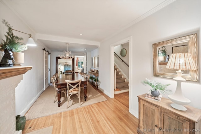 2252 S Troost Ave, Tulsa, OK 74114 - dining room featuring baseboards, stairs, light wood-style flooring, and a notable chandelier