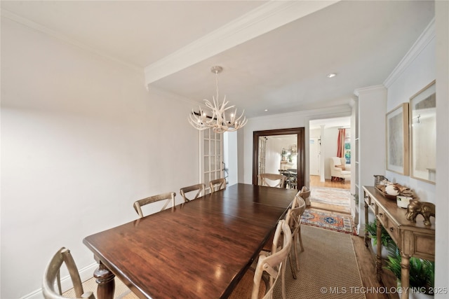 2252 S Troost Ave, Tulsa, OK 74114 - dining room featuring crown molding and a notable chandelier