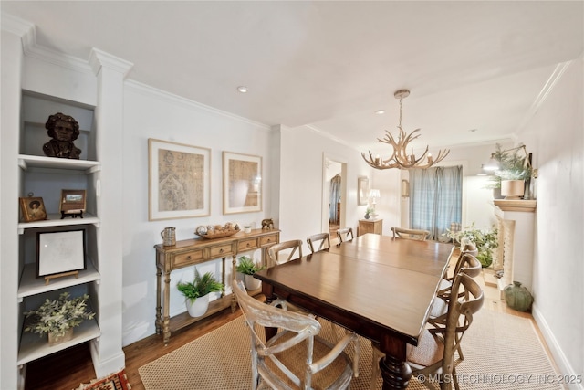 2252 S Troost Ave, Tulsa, OK 74114 - dining space with crown molding, wood finished floors, baseboards, recessed lighting, and a chandelier