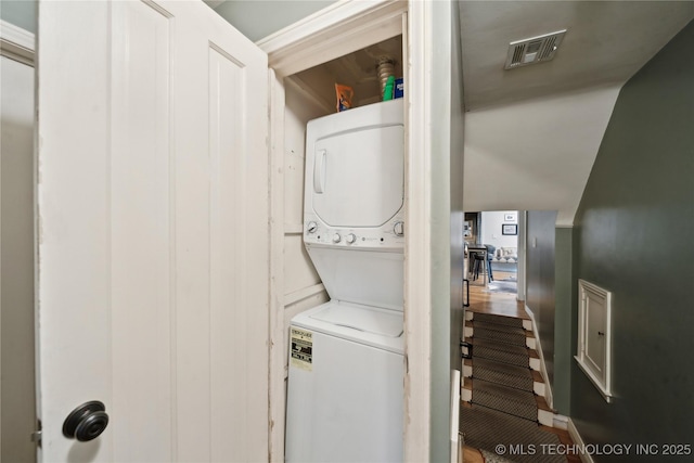 2252 S Troost Ave, Tulsa, OK 74114 - clothes washing area featuring visible vents and stacked washer / dryer
