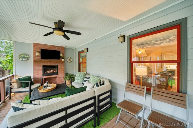 2252 S Troost Ave, Tulsa, OK 74114 - exterior space with an outdoor living space with a fireplace and ceiling fan