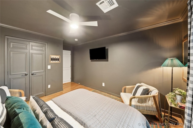 2252 S Troost Ave, Tulsa, OK 74114 - bedroom featuring visible vents, ornamental molding, baseboards, and light wood-type flooring