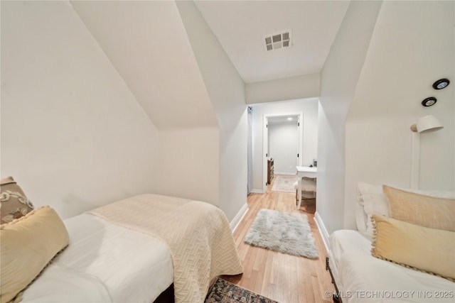 2252 S Troost Ave, Tulsa, OK 74114 - bedroom featuring light wood-style floors, baseboards, and visible vents