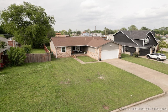 view of front of property featuring fence, driveway, a front lawn, and brick siding