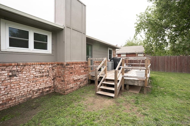 view of yard with fence and a wooden deck