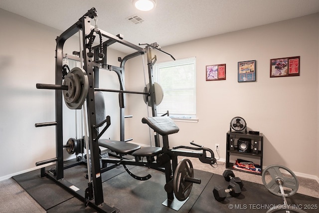 workout room with baseboards and visible vents