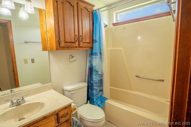 bathroom featuring shower / bath combo with shower curtain, toilet, and vanity