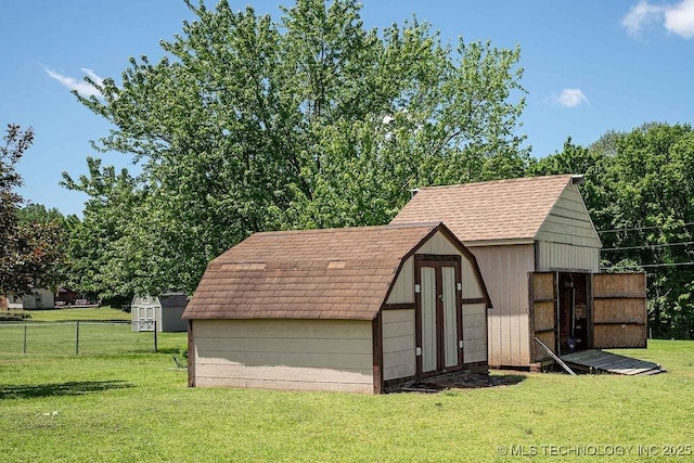 view of shed featuring fence