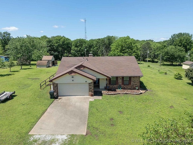 ranch-style house featuring concrete driveway, an attached garage, and a front lawn