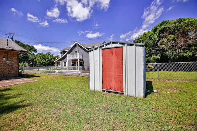 view of shed with a fenced backyard