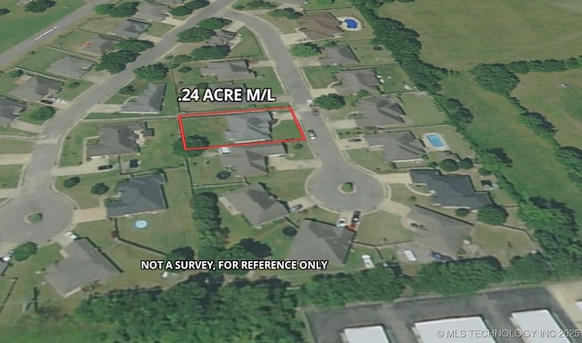 aerial map of property and surrounding area with property parcel outlined