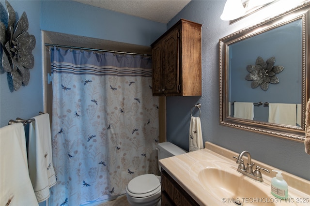 bathroom featuring vanity, toilet, and a shower with shower curtain