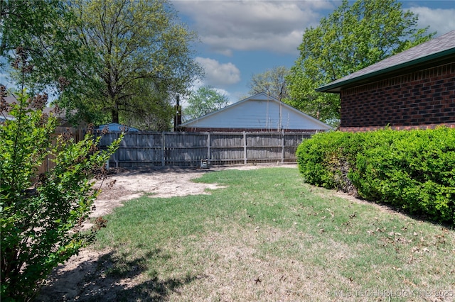 view of yard with a fenced backyard