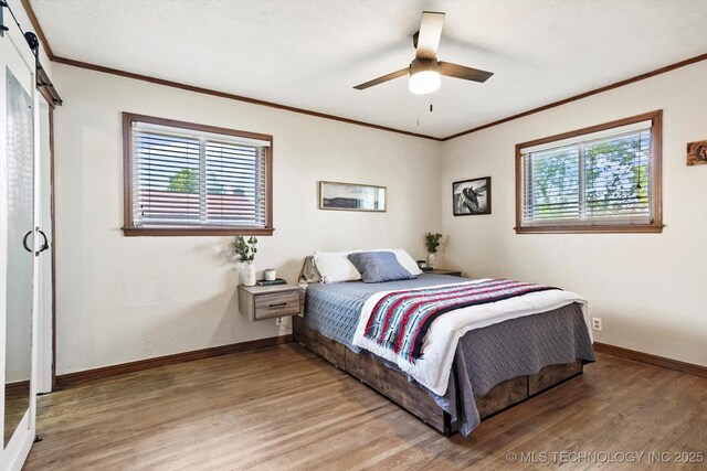 4604 Maple Dr, Sand Springs, OK 74063 - bedroom featuring crown molding, baseboards, ceiling fan, and light wood finished floors