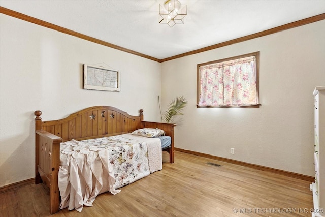 4604 Maple Dr, Sand Springs, OK 74063 - bedroom featuring baseboards, visible vents, ornamental molding, and light wood-type flooring