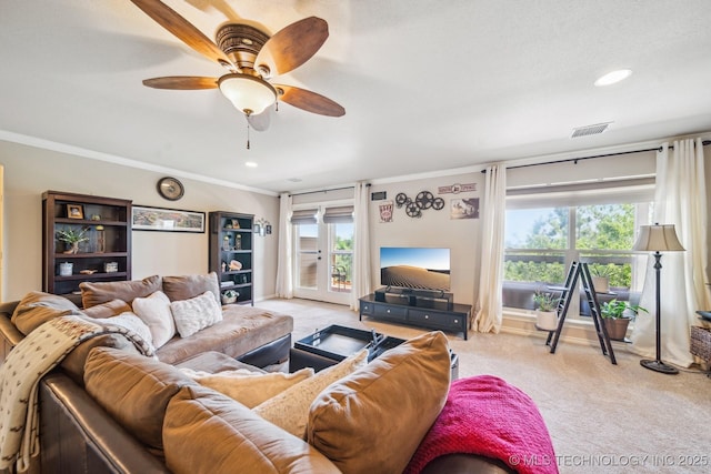 living area with visible vents, carpet floors, ornamental molding, recessed lighting, and a ceiling fan