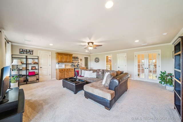 living room featuring crown molding, light colored carpet, french doors, recessed lighting, and visible vents