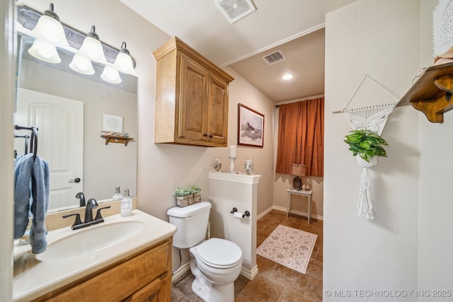 bathroom with visible vents, tile patterned flooring, toilet, and vanity