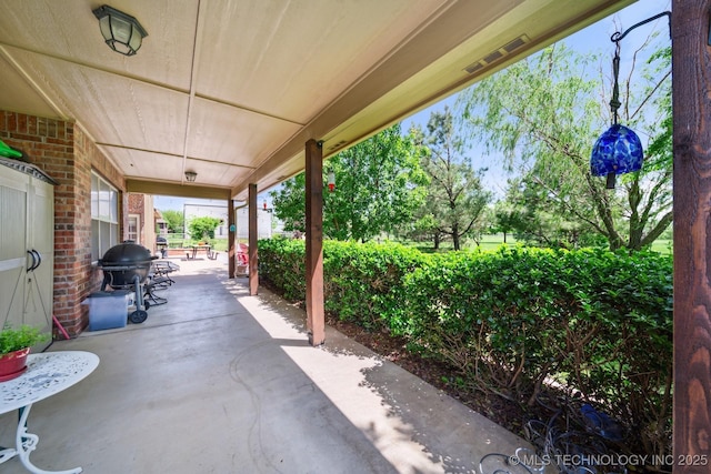 view of patio / terrace with visible vents, covered porch, and grilling area
