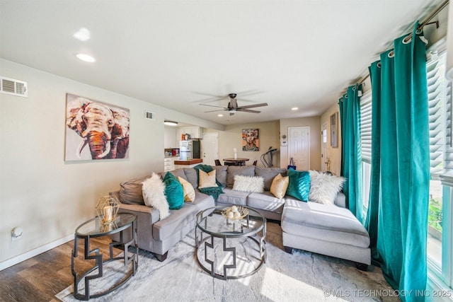 living area featuring ceiling fan, recessed lighting, wood finished floors, and visible vents