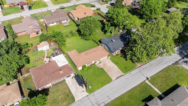 birds eye view of property with a residential view
