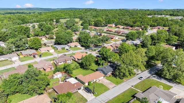aerial view featuring a residential view and a view of trees