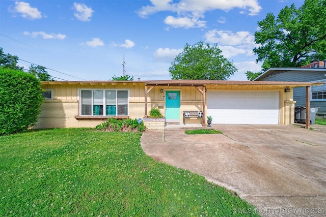 ranch-style home featuring brick siding, an attached garage, a front yard, and concrete driveway