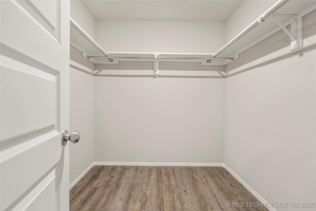 29327 E 80th St SE, Broken Arrow, OK 74014 - walk in closet with wood finished floors