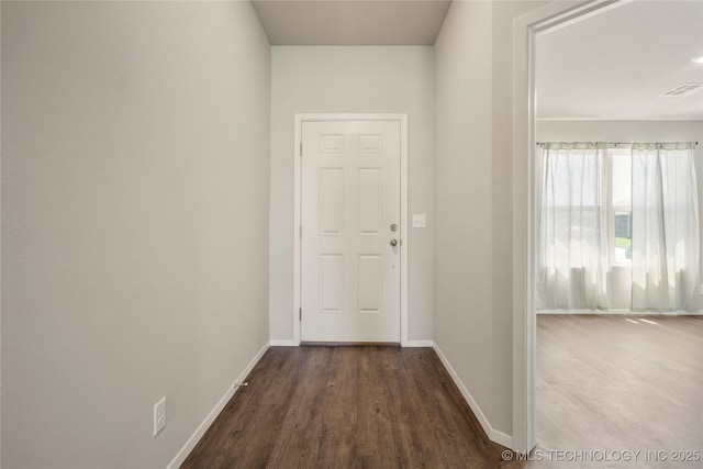 29327 E 80th St SE, Broken Arrow, OK 74014 - hallway featuring visible vents, baseboards, and dark wood finished floors